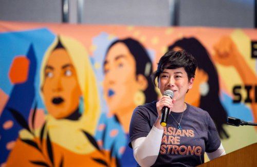 Event organizer Zeien Cheung speaks during the 'Break the Silence' event at the Asian Art Museum in San Francisco on March 16, 2022. (Beth LaBerge/KQED)